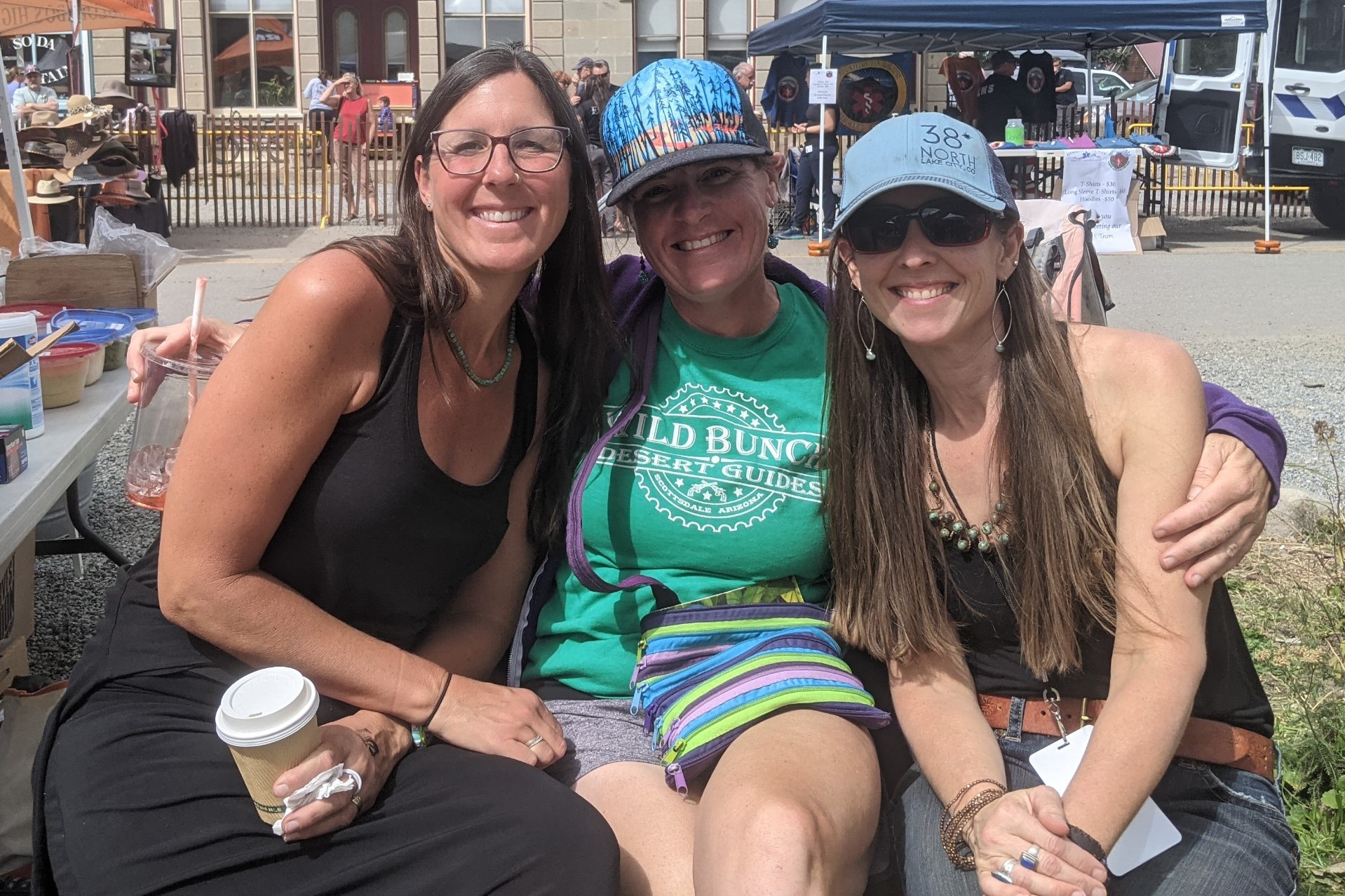 Laurel Darren (center) enjoys a post-race wine festival with her Colorado training partners Amanda Hartman (left) and Lydia McNeese (right).