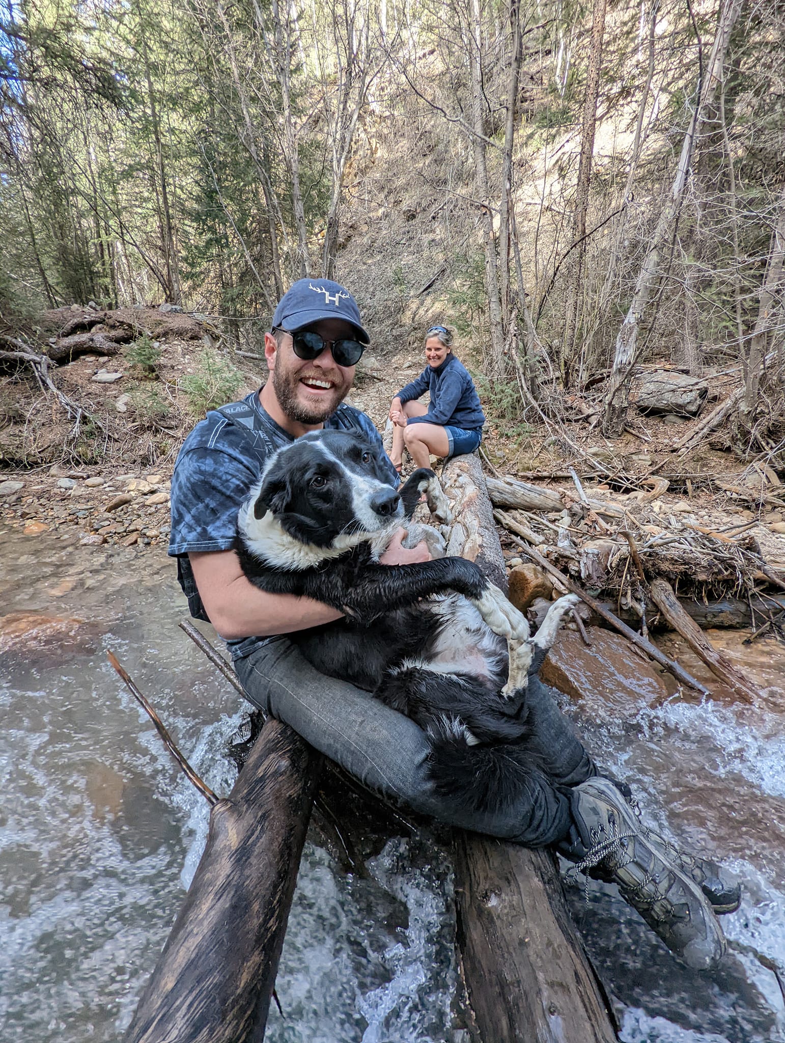 Justin Hill, the owner of Lake City Brewing Company, laughs it up with dog Jackson during a 