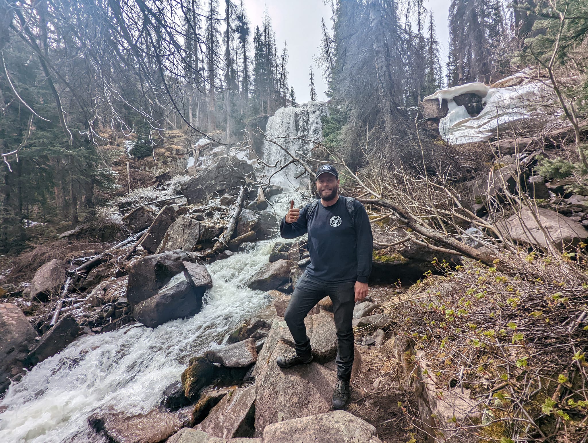 Justin Hill, owner of Lake City Brewing Company, is thumbs up with the waterfall-filled route on the Cataract Gulch trail.