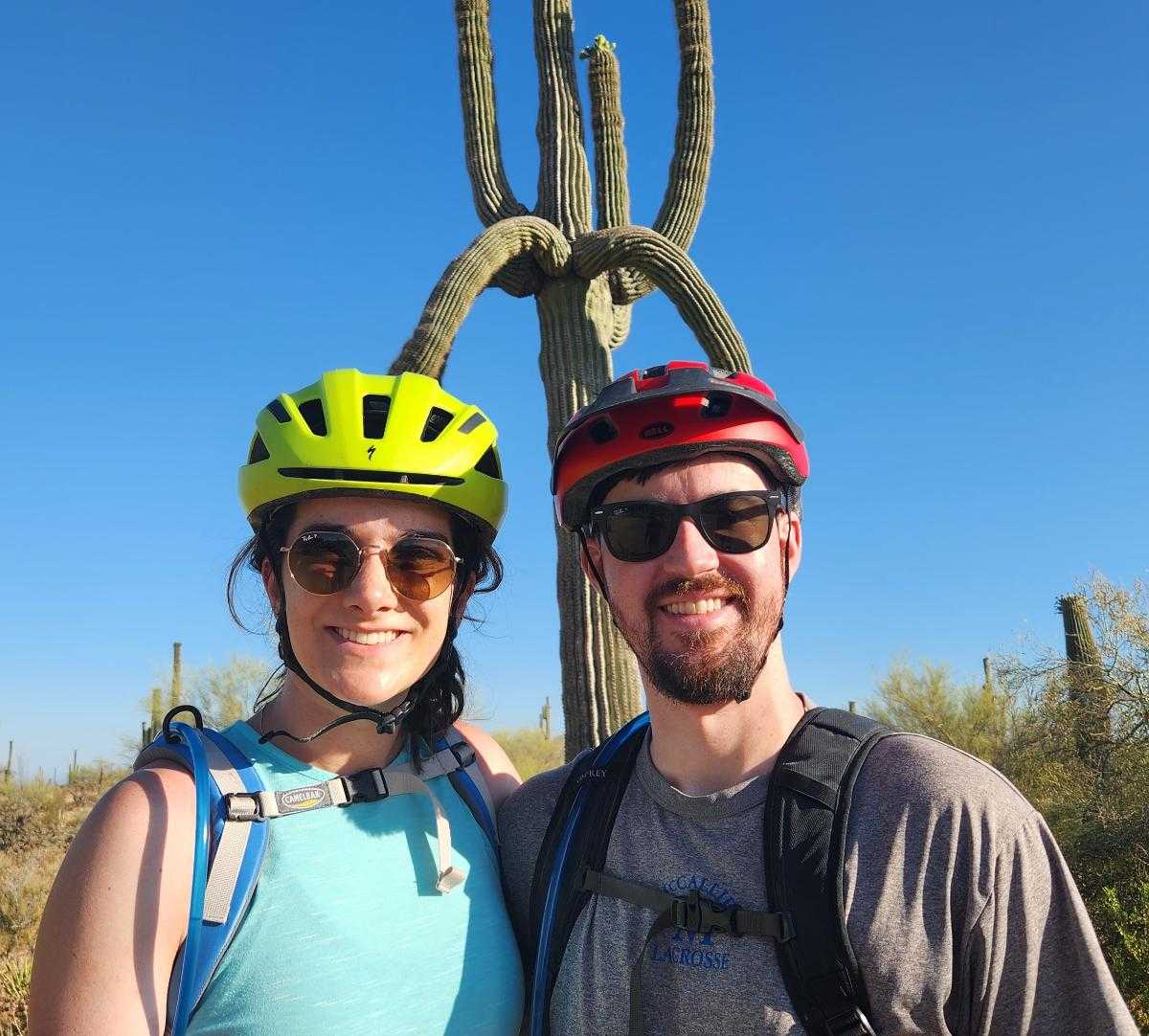 A couple of bikers pause for a picture in front of a crazy cactus during a Wild Bunch outing.