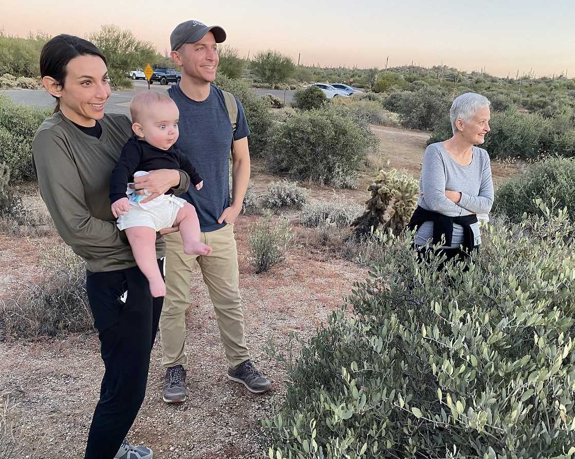 Three generations of a family enjoys a trademark Phoenix sunset during an ADA handicap accessible hike with the Wild Bunch Desert Guides.