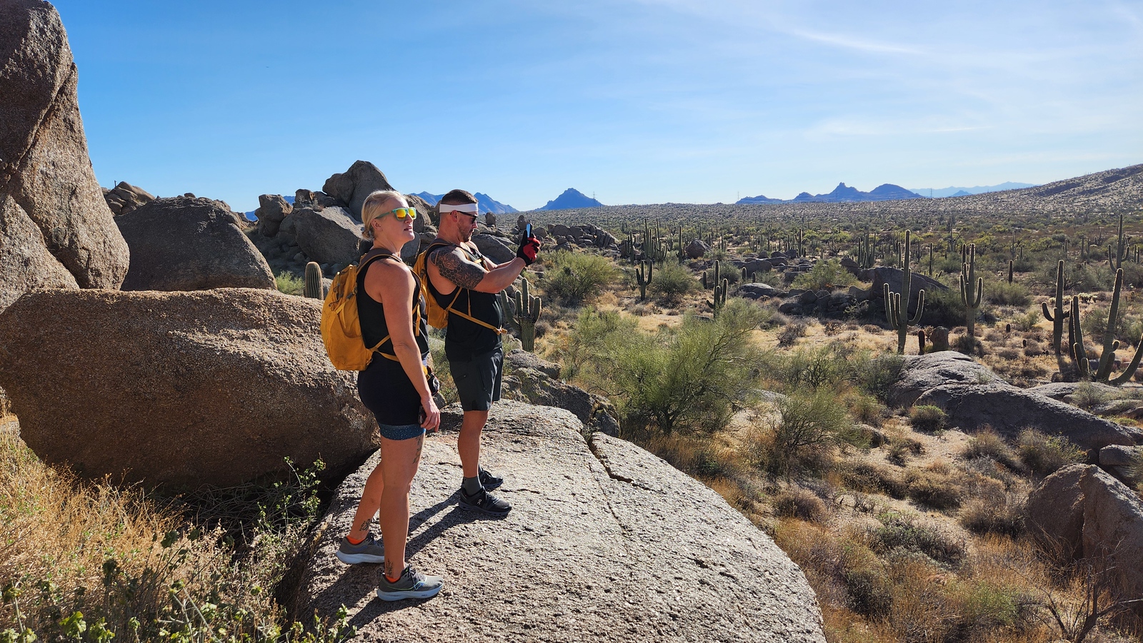 A couple pauses during one of the Wild Bunch's Phoenix hiking tours to take in the breathtaking scenery together.