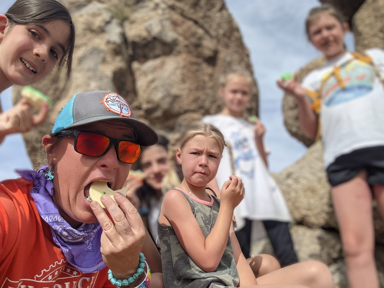 Kids of any age are welcome with their parents or guardians on Phoenix adventure tours. Here Wild Bunch owner Laurel Darren shares a treat with the youngest guests she is guiding during a snack break.