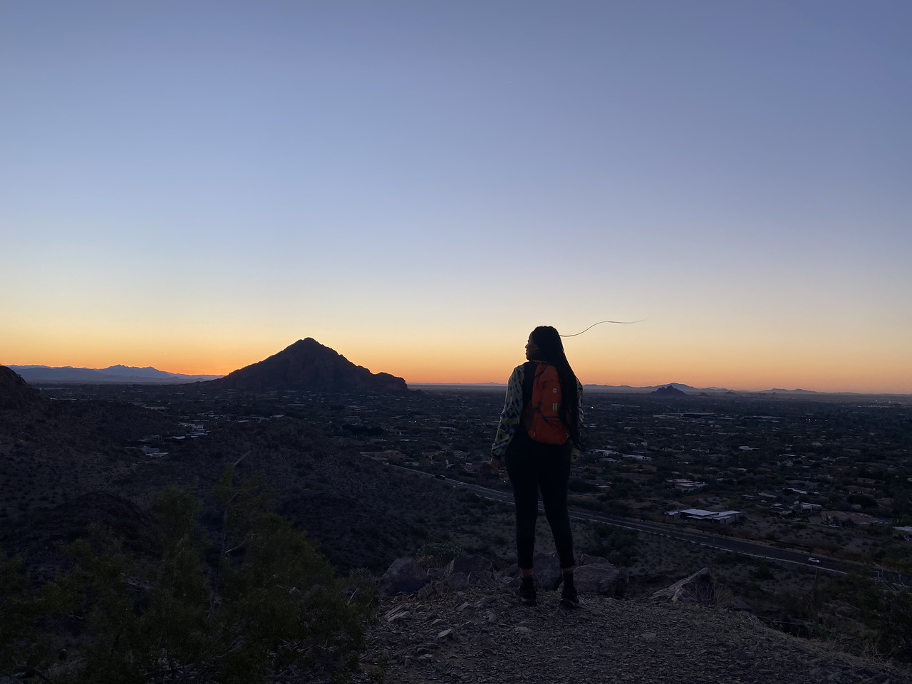 A Wild Bunch guest revels in the amazing scenery during one of our sunrise Phoenix hiking tours.
