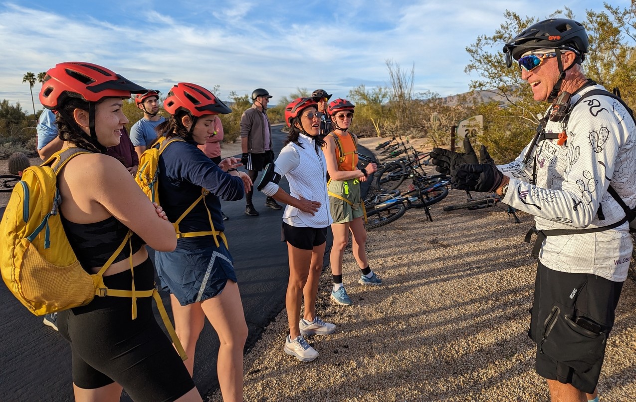 A Wild Bunch group receives some safety instructions from their certified, medically trained adventure guide.