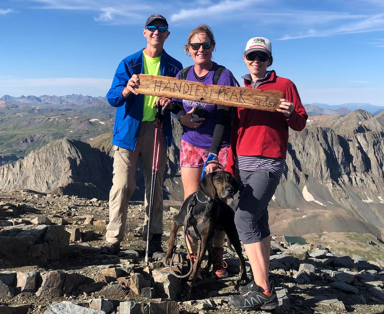 The foursome reaching the summit of Handies Peak to spread some of the ashes of their dearly departed Daisy Mae with her Plott Hound understudy Waylon are (R-L) Glenn Heumann, Laurel Darren and Lydia McNesse.