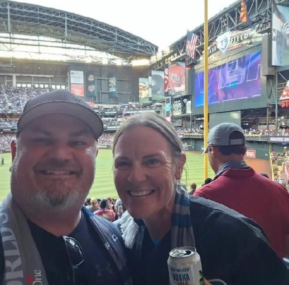 JJ Briles (left), owner of Stellar Adventures, pauses to pose for a picture with Wild Bunch Desert Guides owner Laurel Darren (right) during Game 3 of the 2023 World Series at Chase Field in Phoenix.