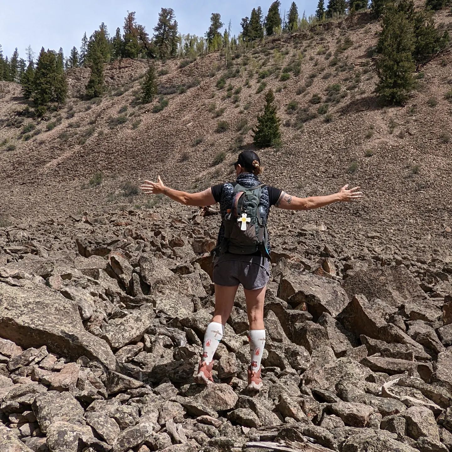 Wild Bunch owner Laurel Darren takes in a craggy landscape during a Colorado summer hiking tour in 2022.