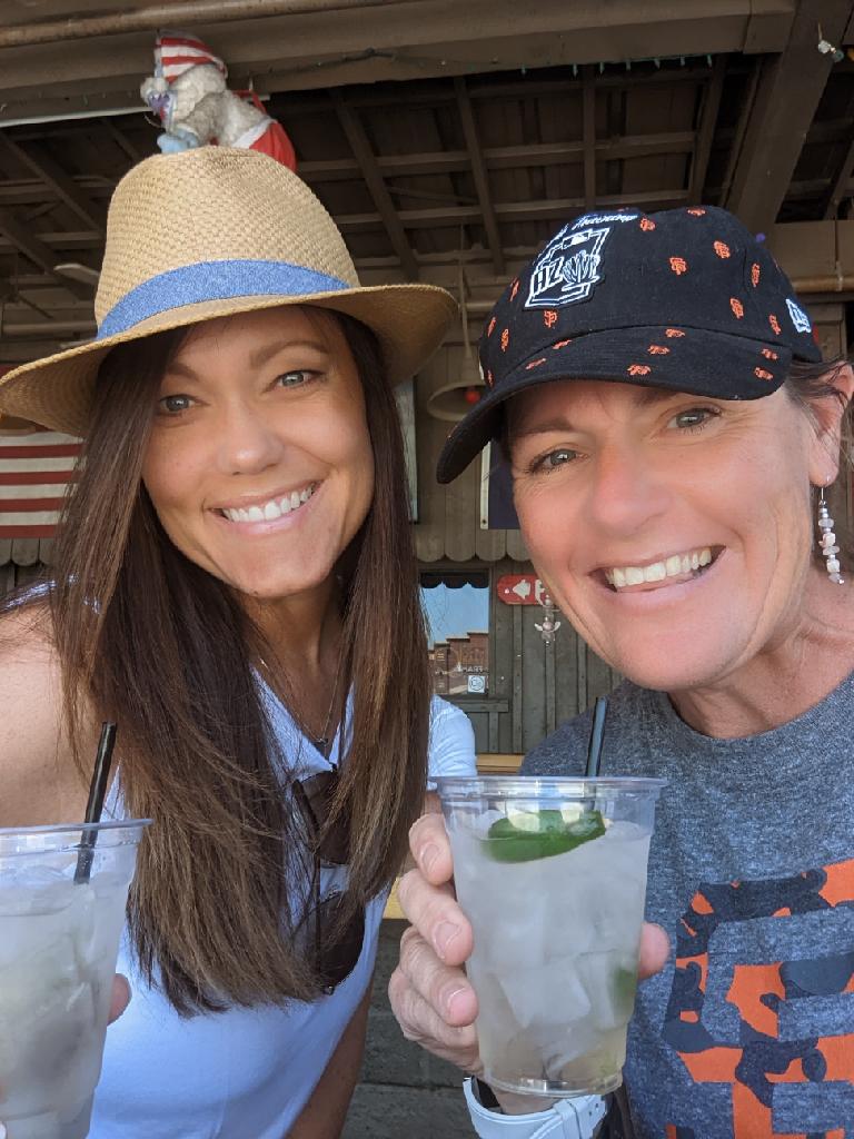 Laurel Darren (right) shares some smiles recently with childhood friend and high school softball teammate Kelly Finch.