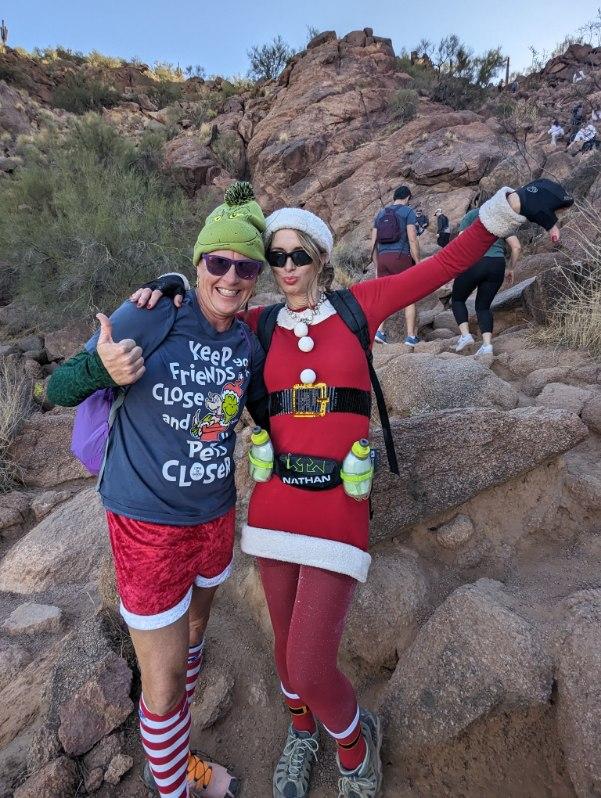 Wild Bunch owner Laurel Darren poses with Mrs. Claus atop Camelback Mountain.