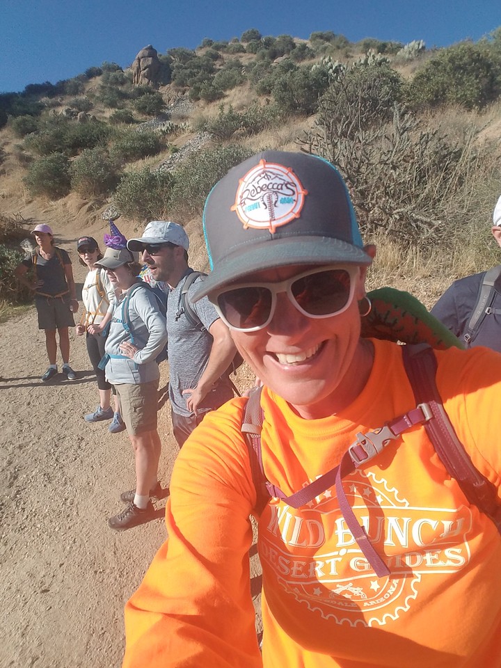 Laurel Darren (front) -- the owner of Wild Bunch Desert Guides -- hams it up for the camera during one of her adventure company's guided Phoenix hiking tours.