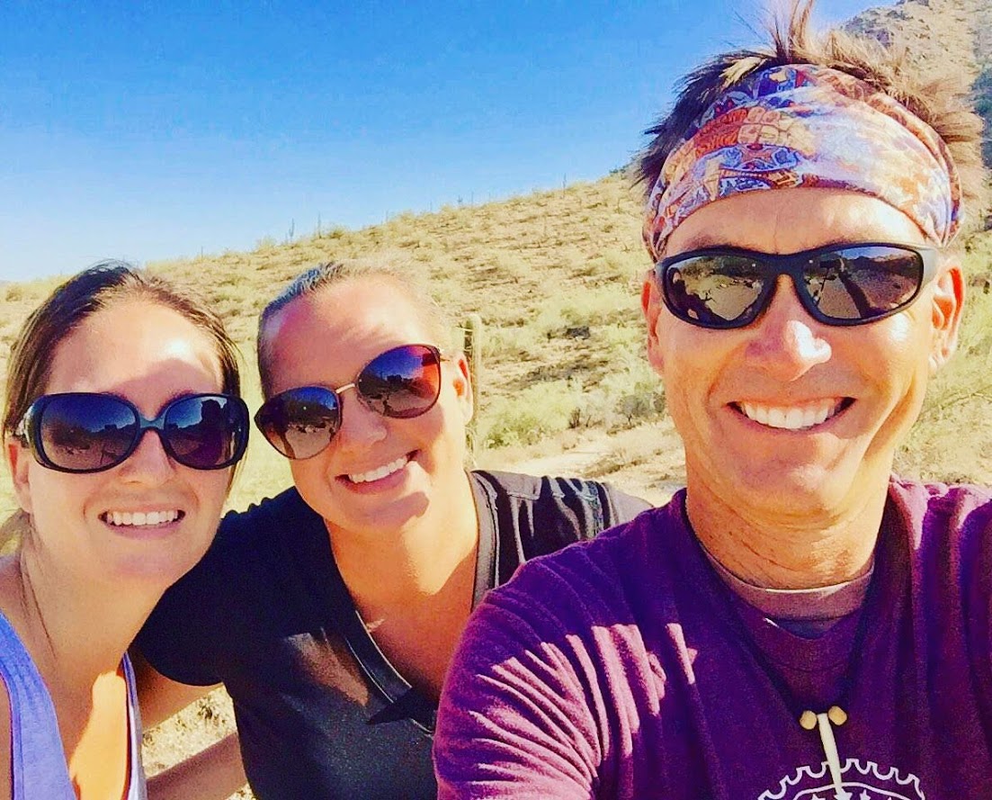 Matt Kalina poses with a pair of guests while guiding a Phoenix hiking tour for the Wild Bunch Desert Guides.