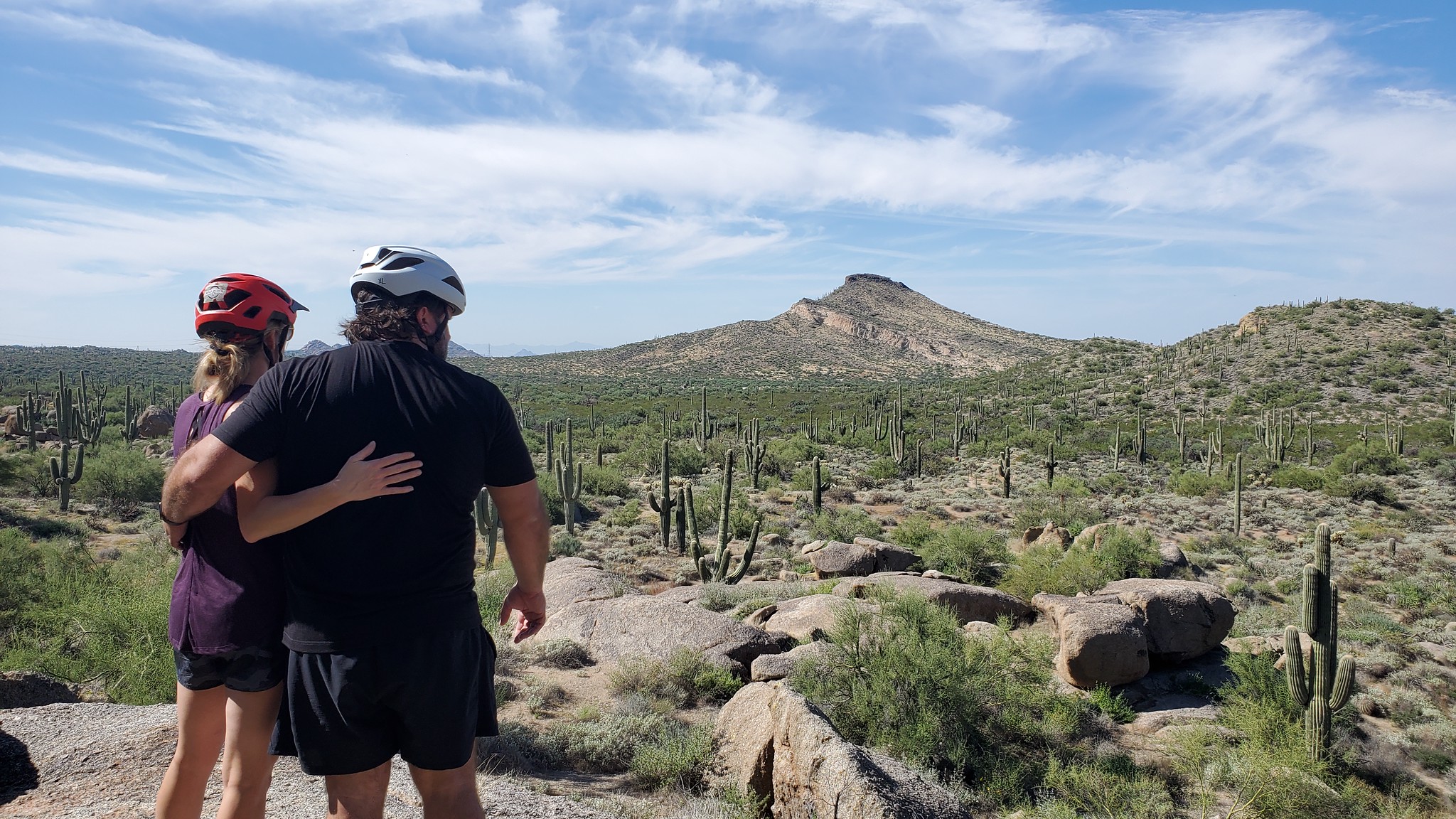 A couple are arm-in-arm while surveying together the beautiful otherworldly landscape of the Sonoran Desert during one of the Phoenix adventure tours offered by the Wild Bunch Desert Guides. Loving relationships and memorable experiences together are always high on everybody's list when assessing one's blessings during the Thanksgiving holiday.