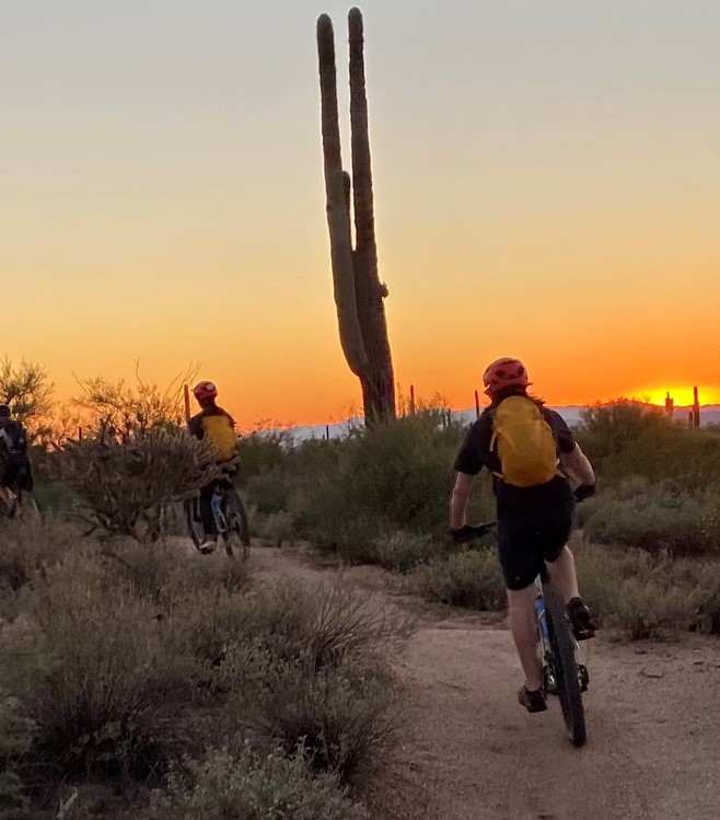 A sunset mountain bike tour with the Wild Bunch Desert Guides is both a thrilling and beautiful romantic experience for couples.