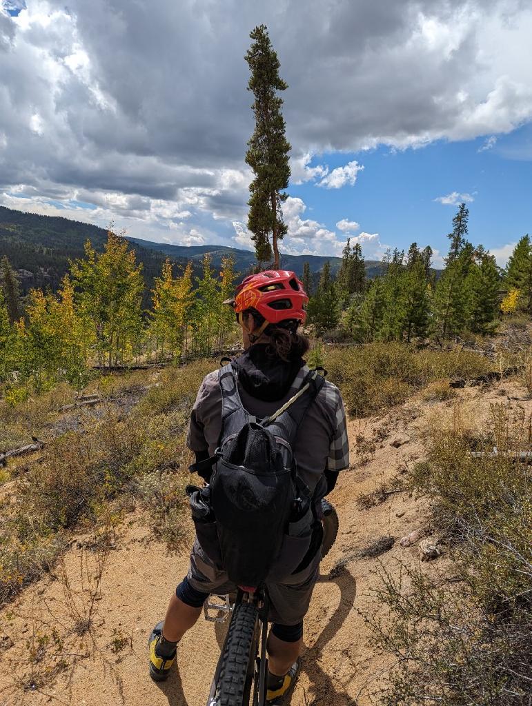 Reed Betz of Irwin Guides considers the cloud formations to correctly predict the weather patterns during a mountain bike ride with Wild Bunch owner Laurel Darren.