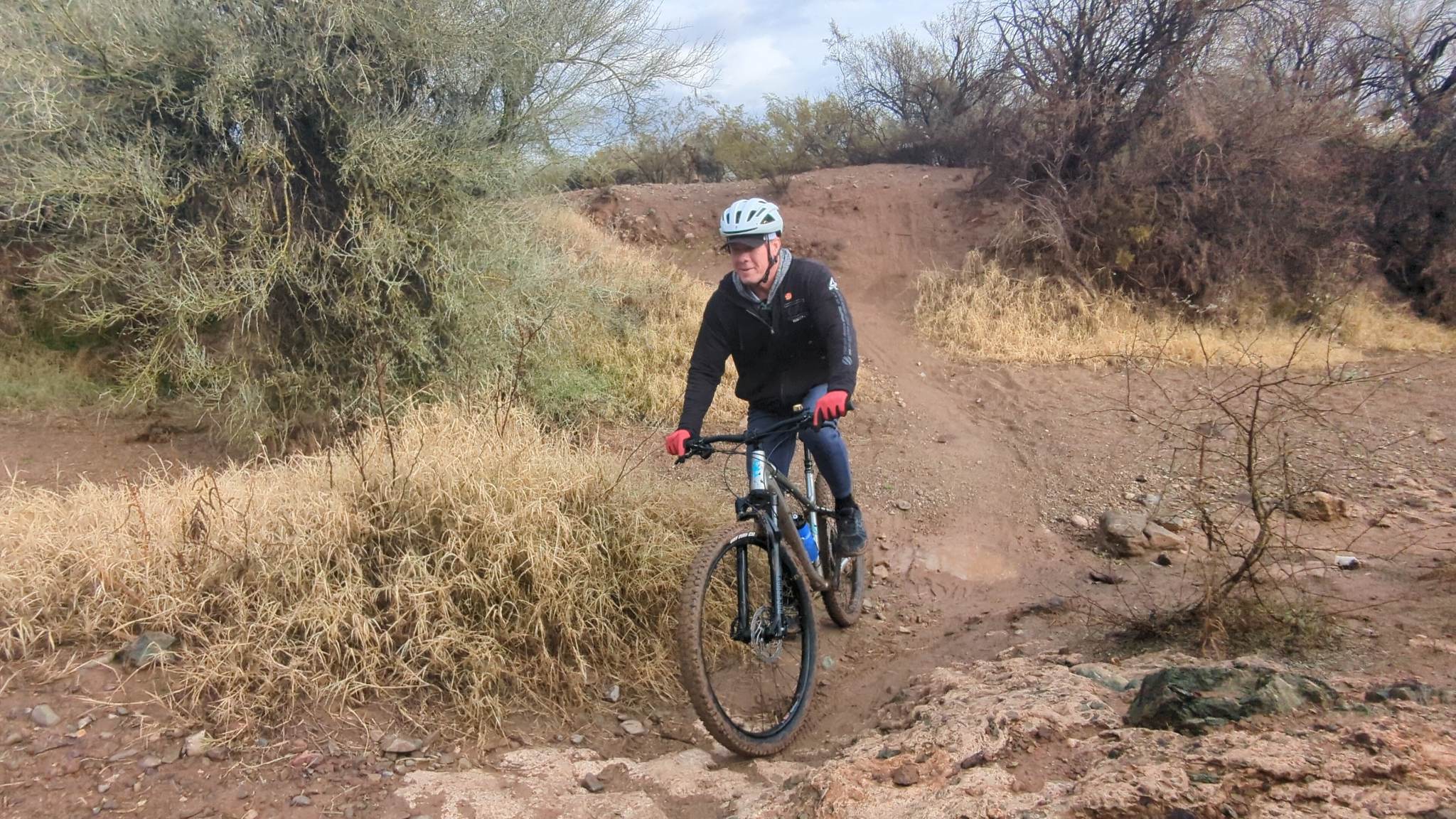 Brent comes rolling down a hill during our Phoenix mountain bike tour together.