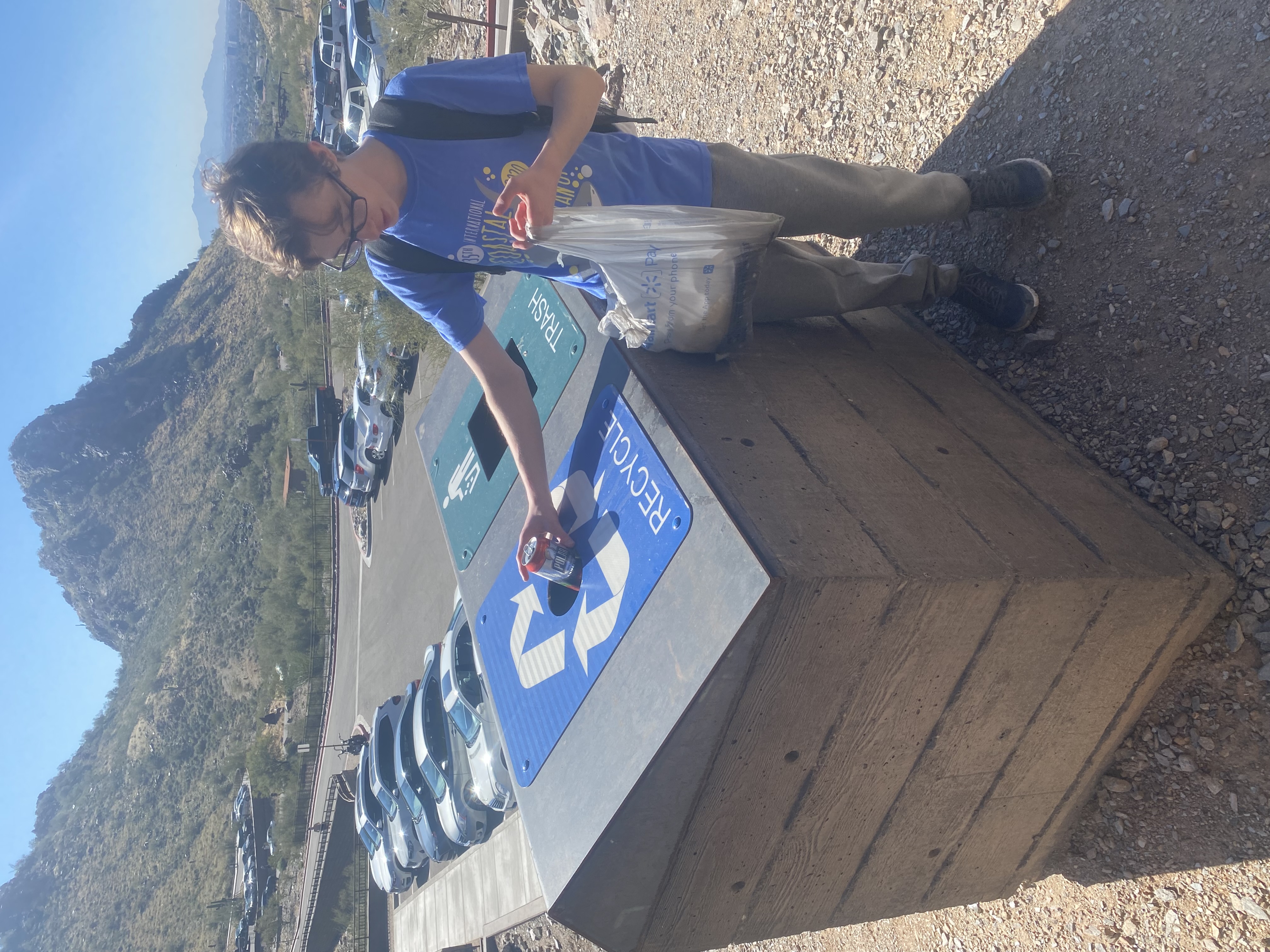 Florida's Ryan Moraleutz, 14, recycles some of the trash picked up during one of the Phoenix hiking tours offered by the Wild Bunch Desert Guides.