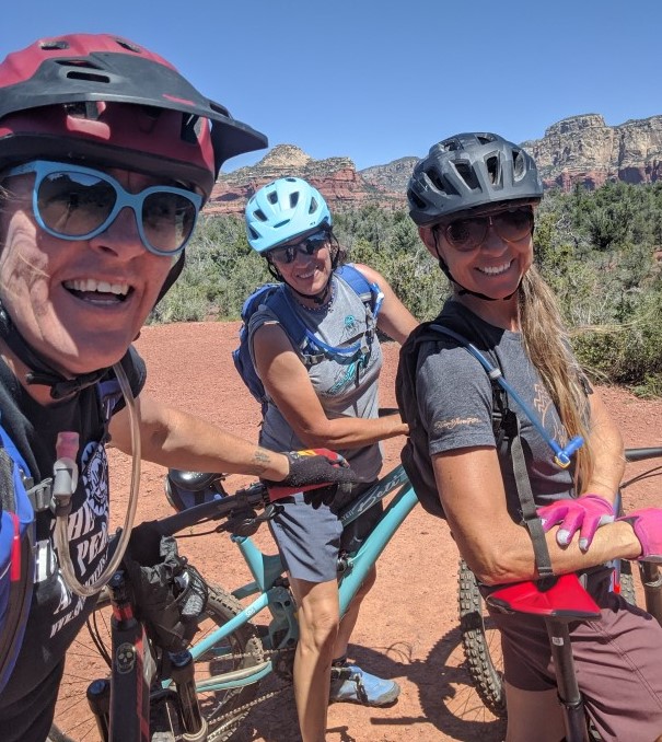 Wild Bunch Desert Guides owner Laurel Darren (left) with trusted guides Ellen and Rebel during a mountain bike ride through the legendary Red Rocks of Sedona.
