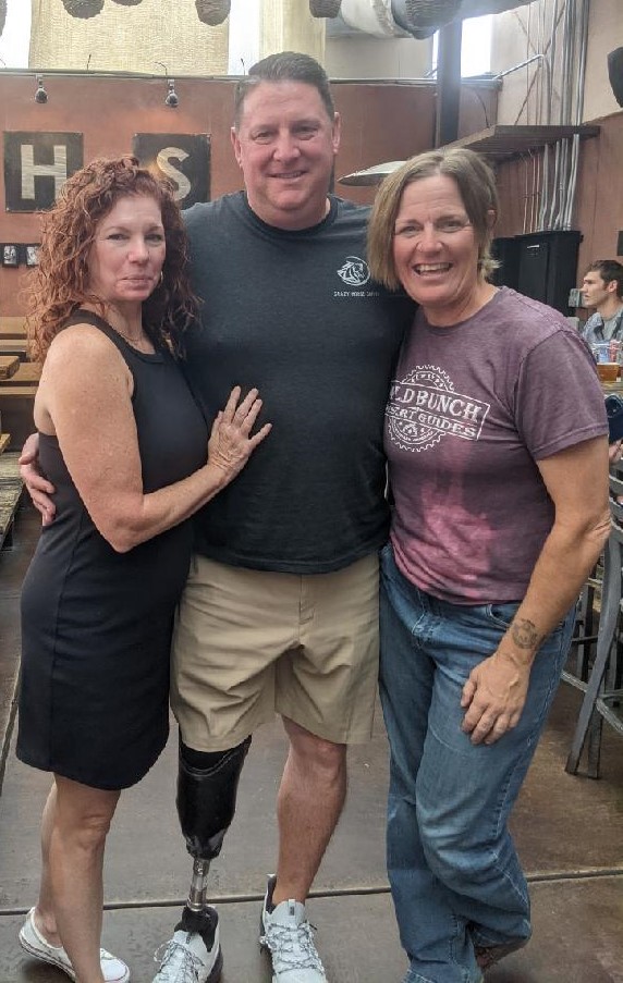 Pictured (left to right) at a Scottsdale restaurant are Tracey and Todd Hjerpe, veterans of two epic Camelback Mountain hikes, and their trusted guide, Lauren Darren, the owner of Wild Bunch Desert Guides. For the first time since Todd's memorable summit on a prosthetic leg in 2019, the trio got together to reminisce and celebrate with a lunch during Thanksgiving week 2021. The entire experience with the Pennsylvania couple -- and the lasting connection forged -- are among the many blessings celebrated this Thanksgiving by the Wild Bunch owner.