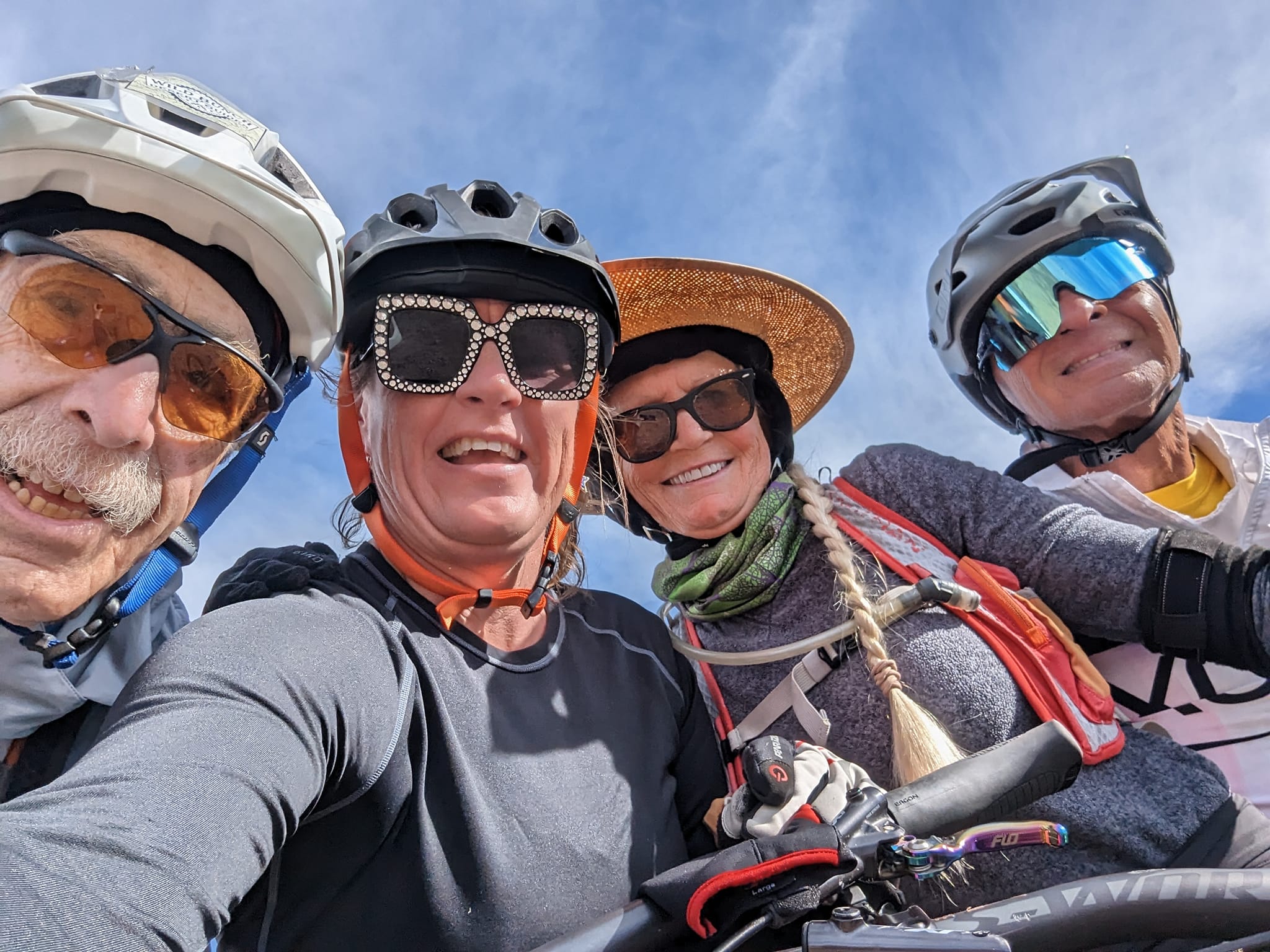 Laurel Darren, second from the left, poses with multiple generations during one of the Wild Bunch's Phoenix mountain bike tours. The variety of people, backgrounds and trails keeps the daily challenge fresh and new for the Phoenix adventure tours owner.