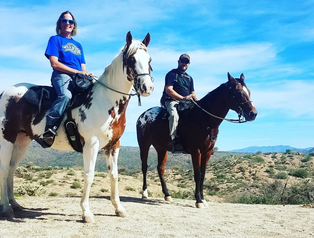 Giddy up! Wild Bunch owner Laurel Darren & her boyfriend Brett are atop horses with Windwalker Expeditions during a desert adventure in Phoenix.