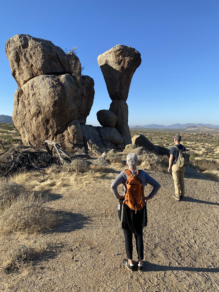 A couple of guests admire a rock formation during our Phoenix hiking tours.